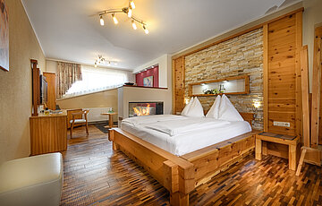 Deluxe Cosy Dream Junior Suite with whirlpool and fireplace at Hotel Winzer