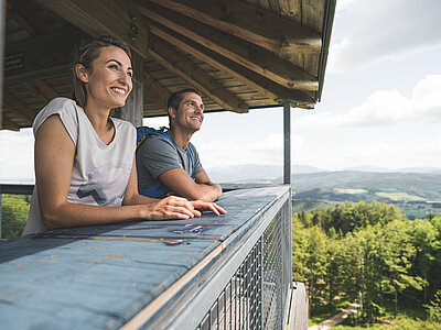 A couple enjoys the view from a viewing tower in the Attersee-Attergau region
